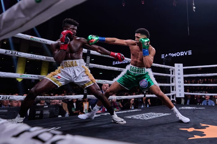 Morrell punches at Agbeko during their match.